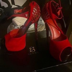 Beautiful sexy black and red heels with Rhine stones. Never used comes with box